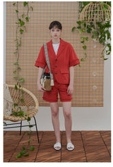 High-Waisted Linen Shorts with Frayed Hem and Button Detailing